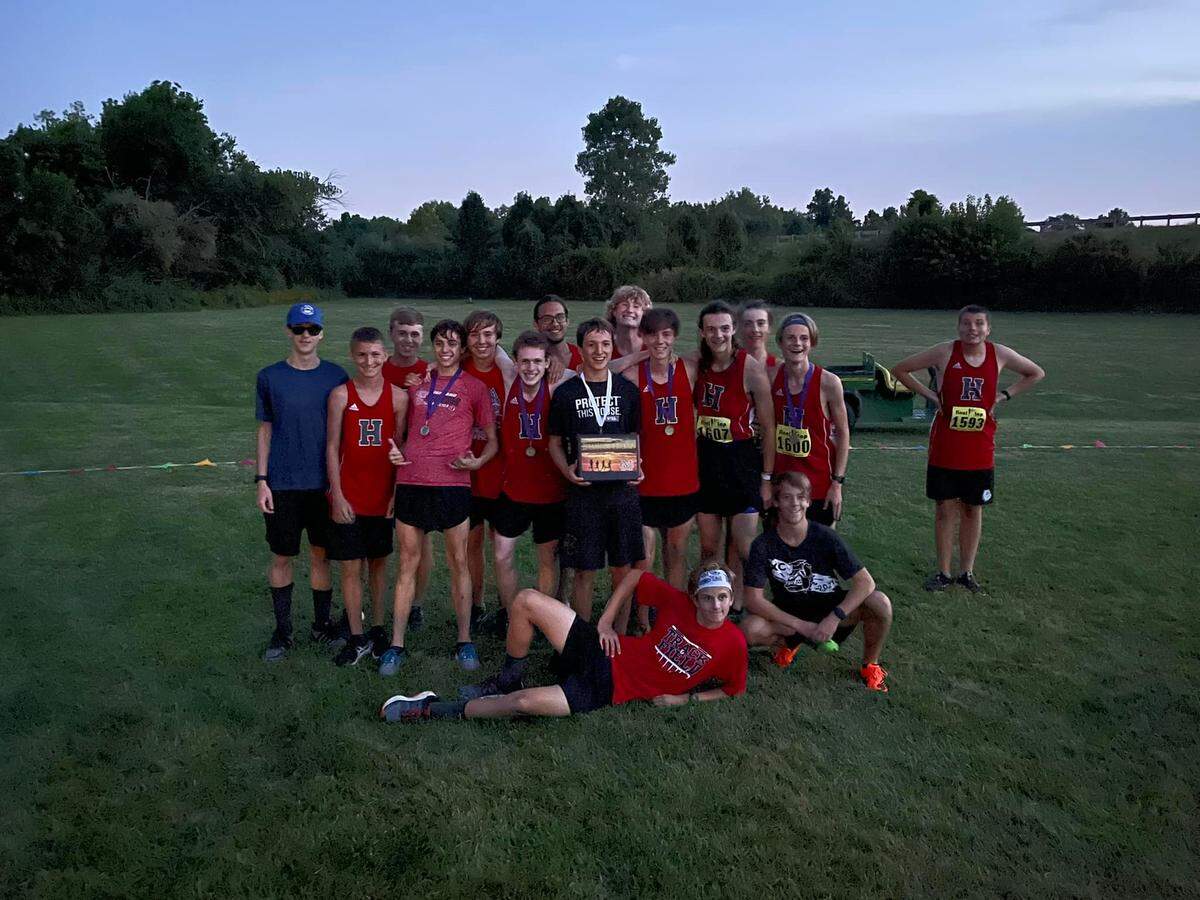The Highland High School boys and girls cross country teams lived up to preseason expectations as they both earned first place honors at the Twilight Invitational hosted by Civic Memorial at the Bethalto Sports Complex on Saturday, Aug. 27. The boys team is pictured here with their first place trophy.