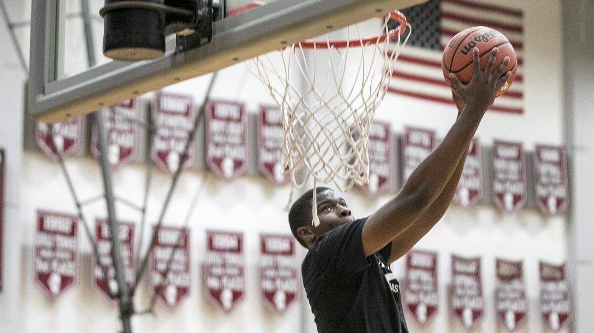 Belleville West senior EJ Liddell goes up for a dunk during the first official day of basketball practice.  The Maroons are ranked 18th in the MaxPreps preseason national boys basketball poll and 32nd in the Prep Circuit.com poll.