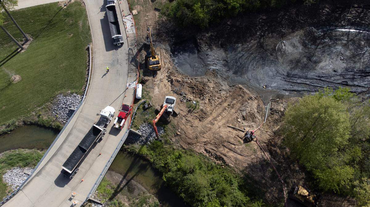 This drone photo shows contractors dredging a pond at Bicentennial Park in Belleville on Monday to make it deeper. The city plans to stock it with bluegill, catfish and large-mouth bass.