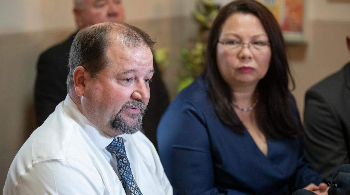 U.S. Sen. Tammy Duckworth, D-Ill. listens to Granite City Mayor Mike Parkinson discuss job losses with the closure of Granite City Steel in 2022.