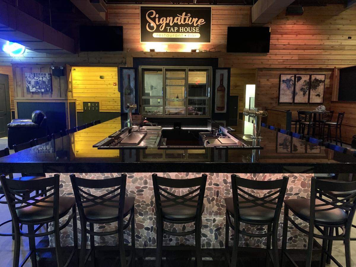 More than 20 people can sit at the horseshoe-shaped bar at Signature Tap House, which is expected to open Feb. 1 near St. Clair Square in Fairview Heights.