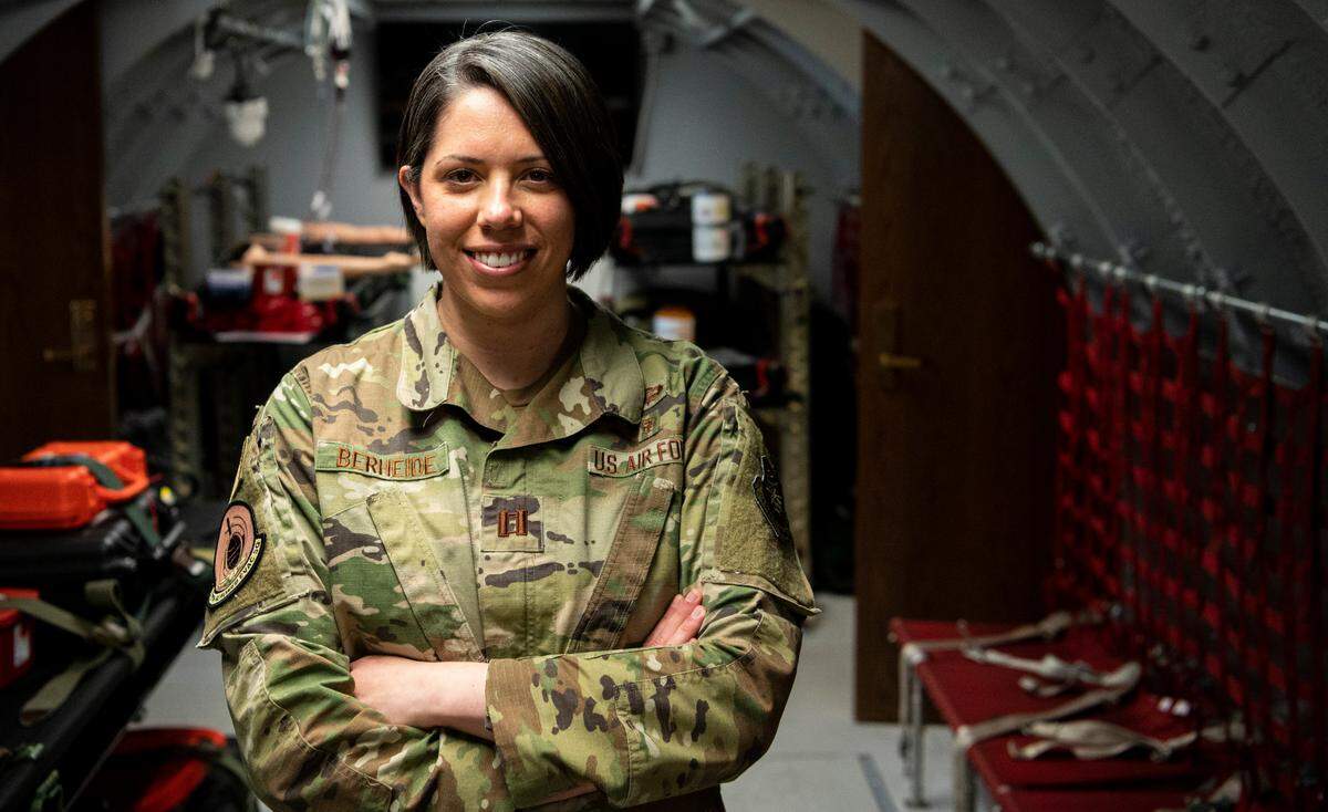 U.S. Air Force Capt. Sarah Berheide, 375th Aeromedical Evacuation Squadron operations support flight commander, stands in a training room at the 375th AES on Scott Air Force Base, Illinois. Berheide is part of the 2019 Women’s Initiative Team that brought change to policy for female hair and uniform regulations.