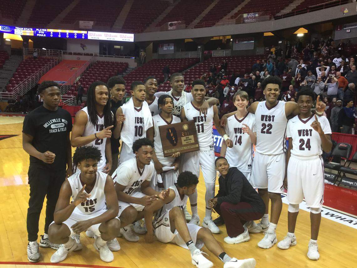 The Belleville West boys basketball team poses with its super-sectional title plaque Tuesday after beating West Aurora at Redbird Arena in Normal. It will be the Maroons' first trip to state since 2002-03 and their first time in the final four since 1965-66.