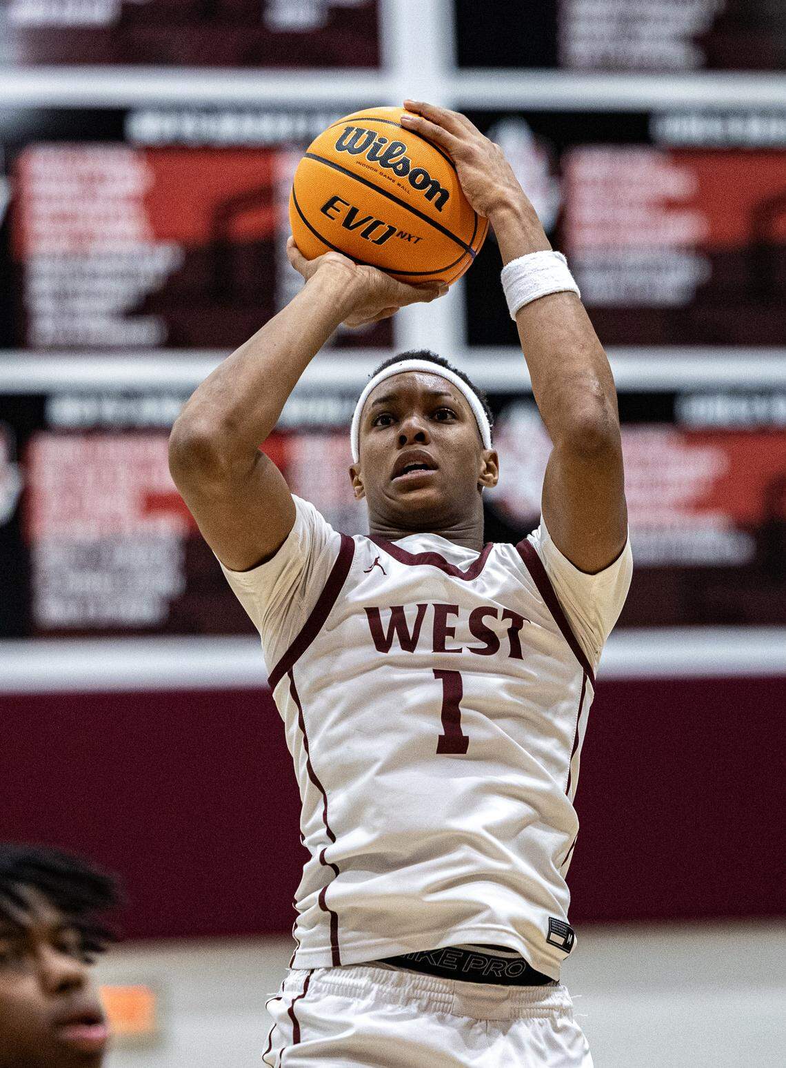 Belleville West junior J’Dyn Lloyd lines up a shot against Belleville East Friday.