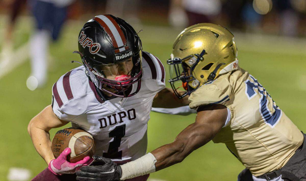 November 1, 2024 - Belleville IL, Dupo Charleston Coldon runs the ball during FridayÕs IHSA first round playoff games between Althoff Crusaders and Dupo Tigers [Photo: Jimmy Simmons]