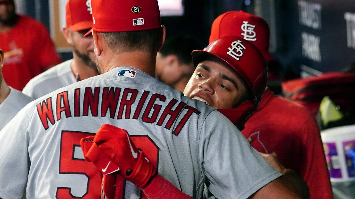 St. Louis Cardinals’ Masyn Winn, right, celebrates in the dugout with Adam Wainwright (50) after hitting a solo home run in the sixth inning of a baseball game against the Atlanta Braves Wednesday, Sept. 6, 2023, in Atlanta. (AP Photo/John Bazemore)