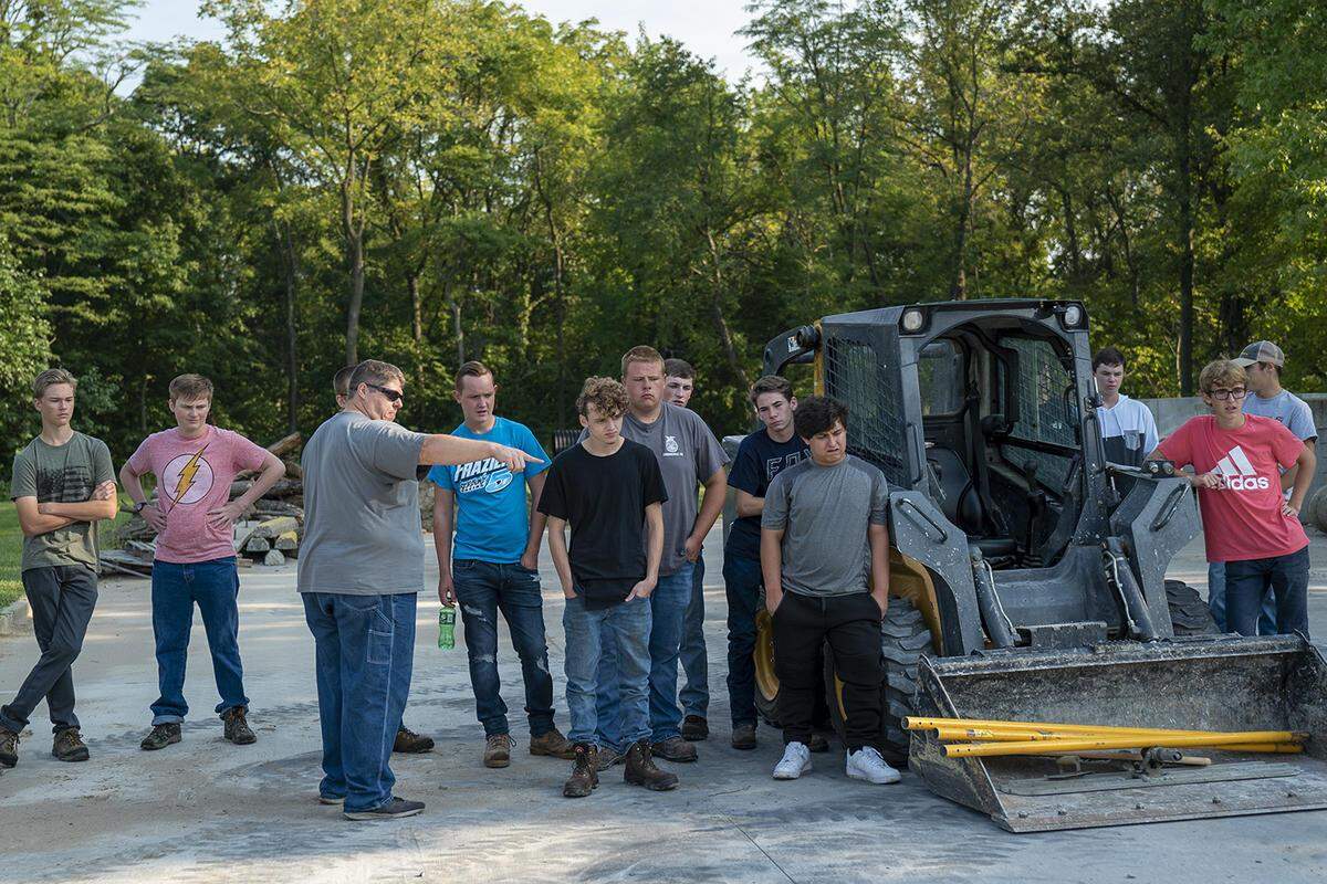 Instructor Jason Jackson explains the different challenges of pouring concrete to his class.