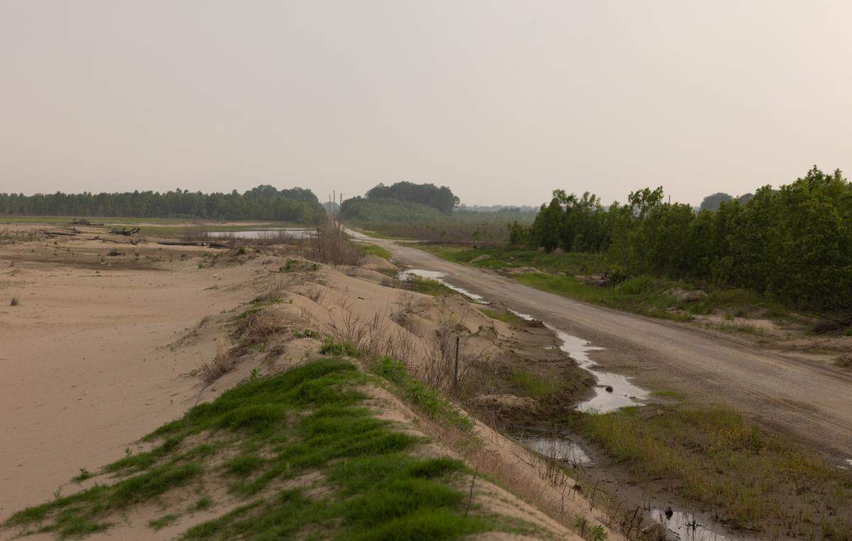 Piles of sand several feet deep remain on former farmland at Dogtooth Bend in May.