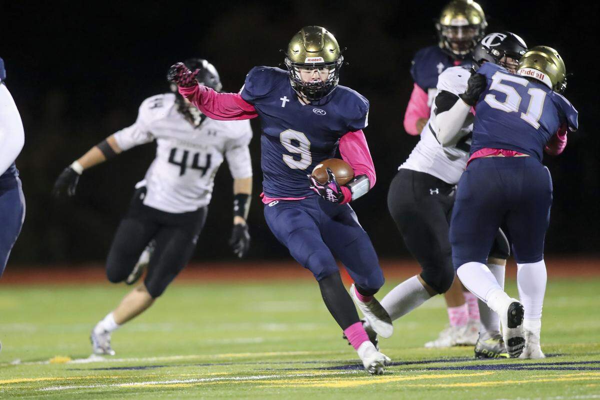 Althoff’s Grant Hoffman carries the ball during Friday night’s South Seven Conference matchup against Carbondale. The Crusaders ultimately lost 10-7.