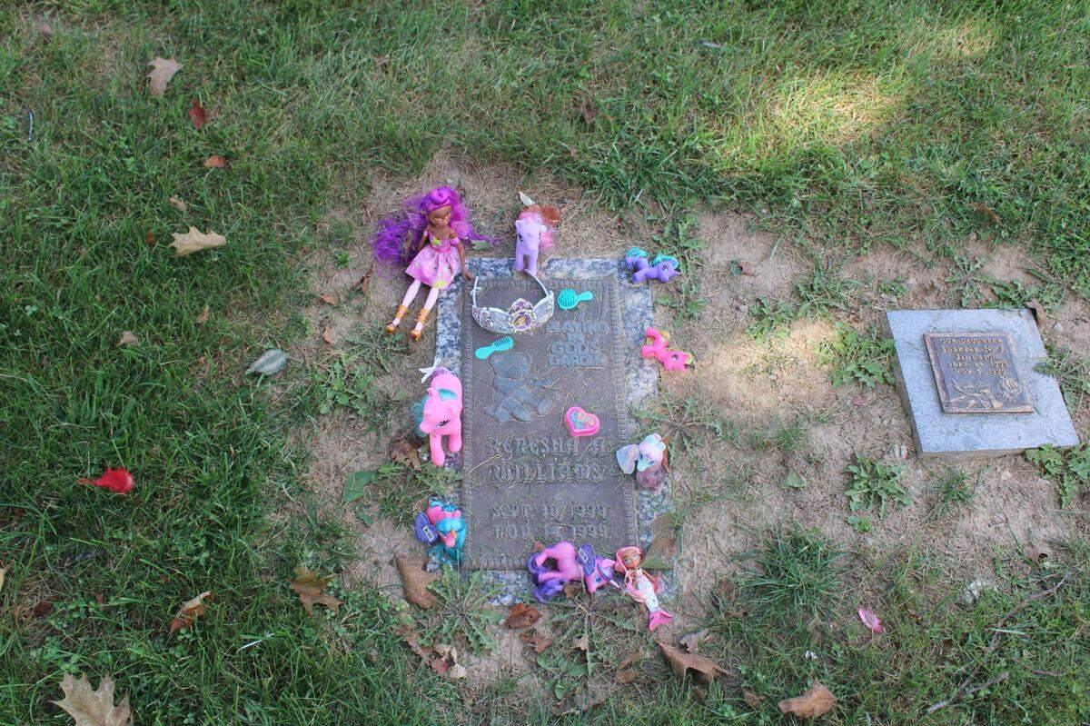 The gravediggers at Sunset Gardens of Memory cemetery in Millstadt, Illinois, have learned to watch their steps in the “Baby Land” section because grieving parents drop off toys, candy, and balloons for their deceased children. (Cara Anthony/KHN)