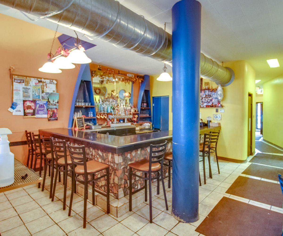 Bigelo’s Bistro in Edwardsville has a colorful, mosaic bar and boat-shaped shelves. It will close Friday.