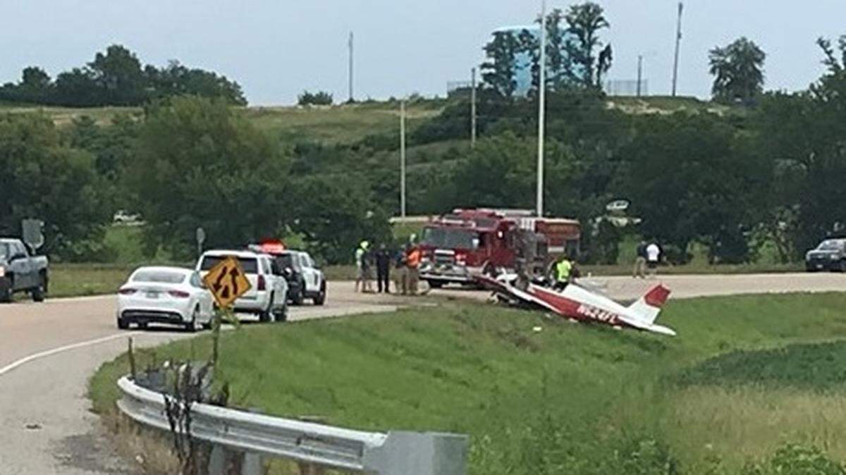 Firefighters cut the away the top of the plane’s cockpit to get to the occupants.