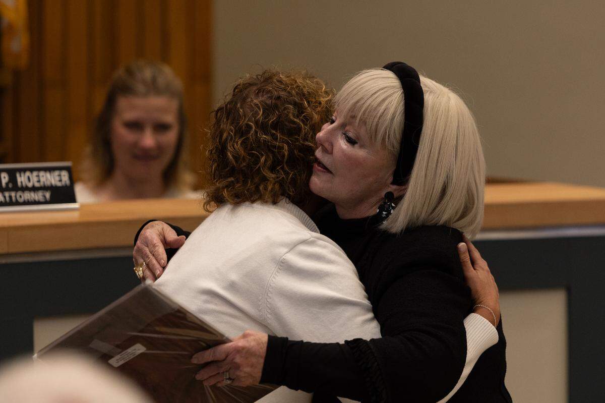 Belleville Mayor Patty Gregory, right, hugs Jenny Gain Meyer on April 21, when Gregory presided over her last City Council meeting. Meyer was sworn in as the city’s new mayor on Wednesday.