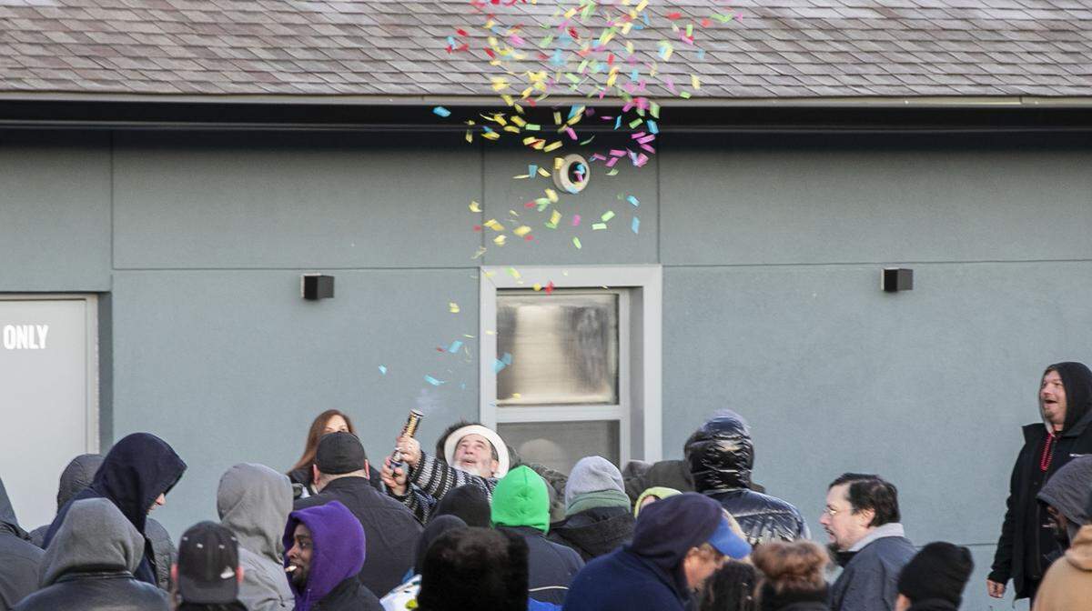 A customer sets off a confetti cannon after exiting Illinois Supply and Provisions, formerly, HCI Alternatives, in Collinsville, the only legal place to purchase marijuana in the region.