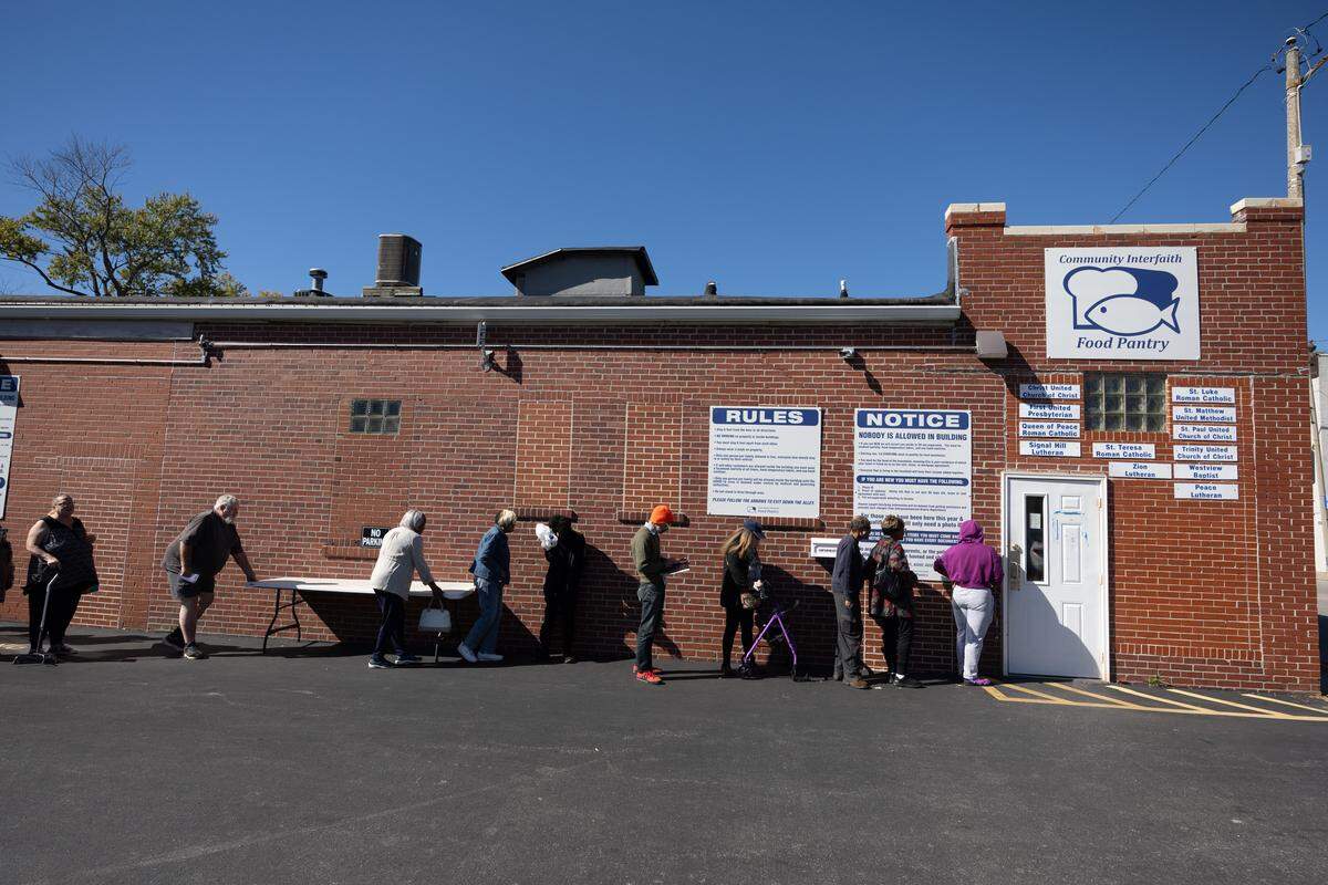 Patrons line up outside of Community Interfaith Food Pantry in Belleville. Administrators and volunteers for the food pantry say demand is already growing at the pantry. They expect it to grow even more in the coming weeks if assistance from food stamps halts.