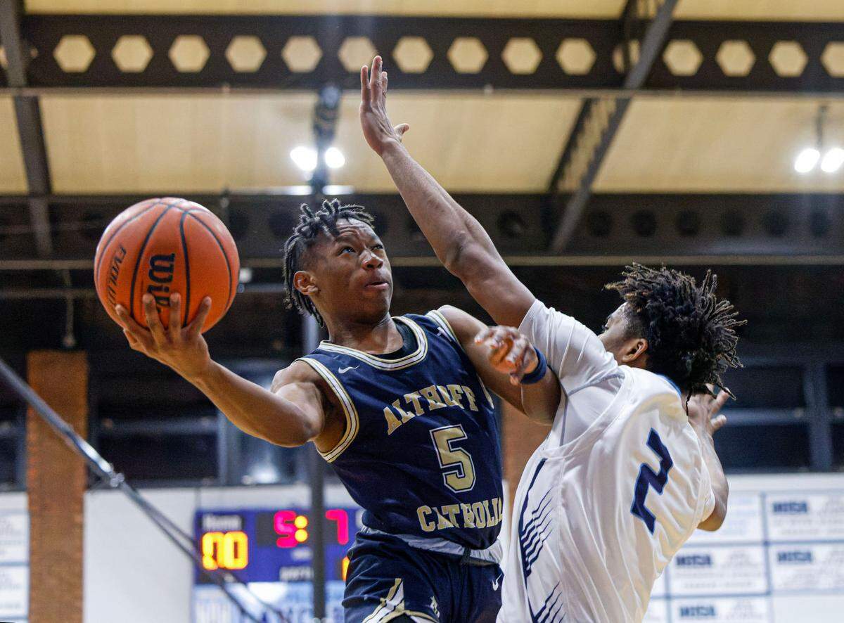 Althoff’s Jordan Lewis attempts a shot during a non-conference game against Belleville East earlier this season. In the latest Belleville News-Democrat sports poll, readers selected Lewis as the top performer from the recent holiday tournament circuit.