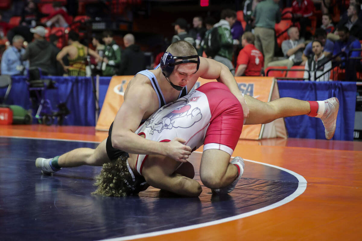 Belleville East’s Dominic Thebeau wrestles Grant’s Cameron Lattimore during their preliminary match at the 2023 IHSA Individual Wrestling State Finals on Thursday in Champaign. Thebeau scored a 13-2 win.