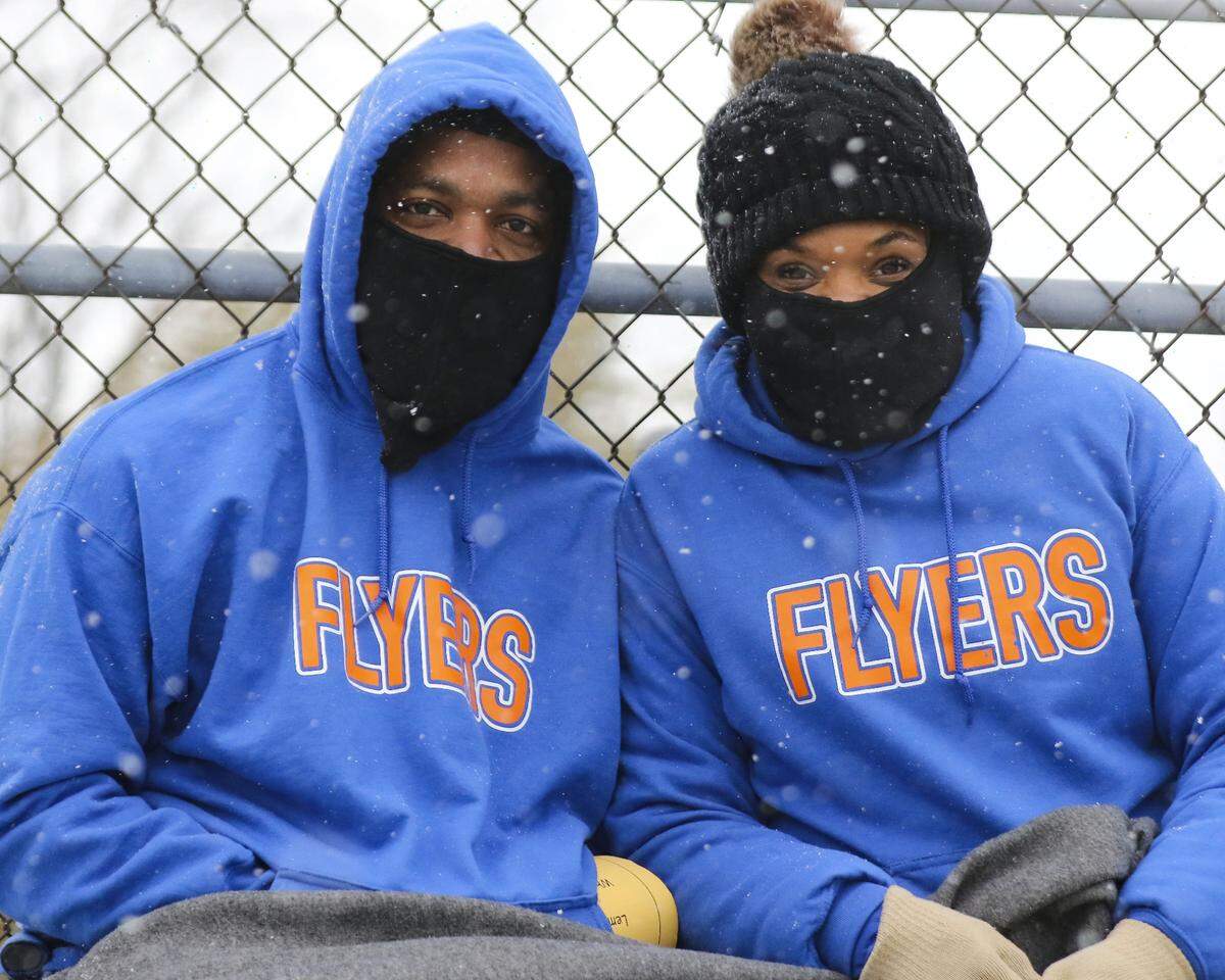 East St. Louis Flyers fans weather the cold to support their team during the IHSA Class 6A semifinal game against Lemont. Their support was rewarded with a 32-29 win and a spot in the state championship game.