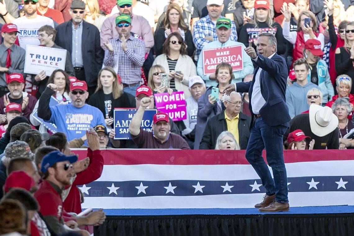 Congressman Mike Bost exits the stage before President Donald Trump arrives at the Make America Great Again rally in Murphysboro.
