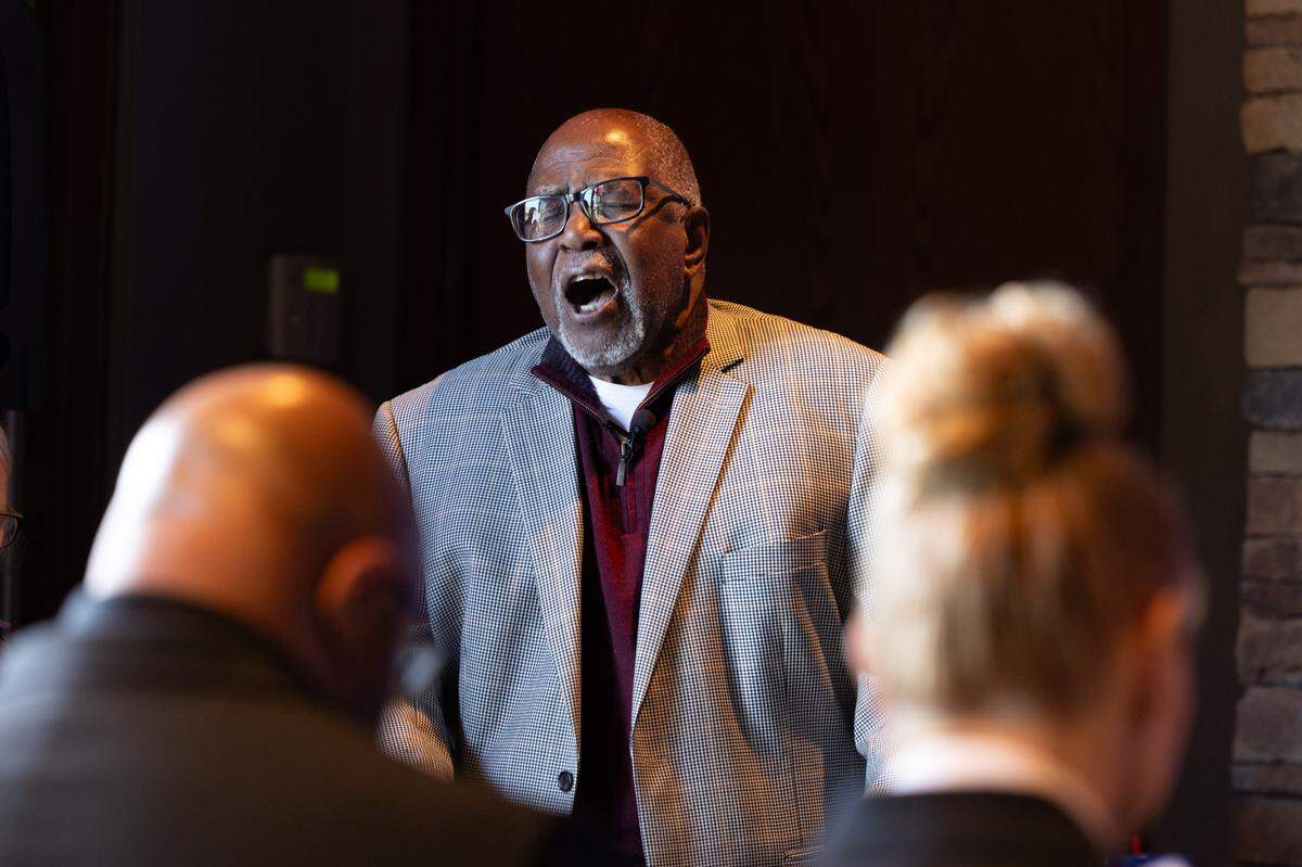 Bob Ellison, 88, sings “Still I Rise” in a powerful baritone while officers bow their head in supplication during a memorial service for fallen police officers of St. Clair County in Christ Church on Frank Scott Parkway in Fairview Heights, Ill. on May 7, 2024.
