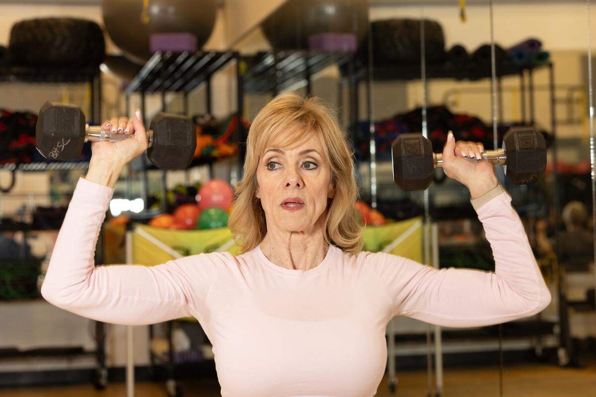 Personal trainer Denise Dill leads an aerobics class at Belleville Health and Fitness Club on Feb. 4, 2025.