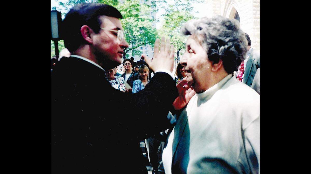 The Rev. Michael G. McGovern gives his first blessing to his mother, Eleanor, after being ordained a priest on May 21, 1994, in the Catholic Archdiocese of Chicago.
