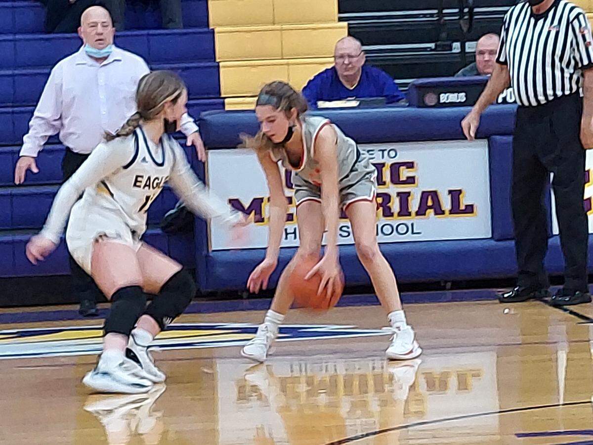 Highland’s Abby Huelsmann tries to work off the dribble against Civic Memorial guard Aubree Wallace during a Mississippi Valley Conference game Tuesday, Dec. 21, at Civic Memorial High School in Bethalto. Highland fell to CM 50-35.