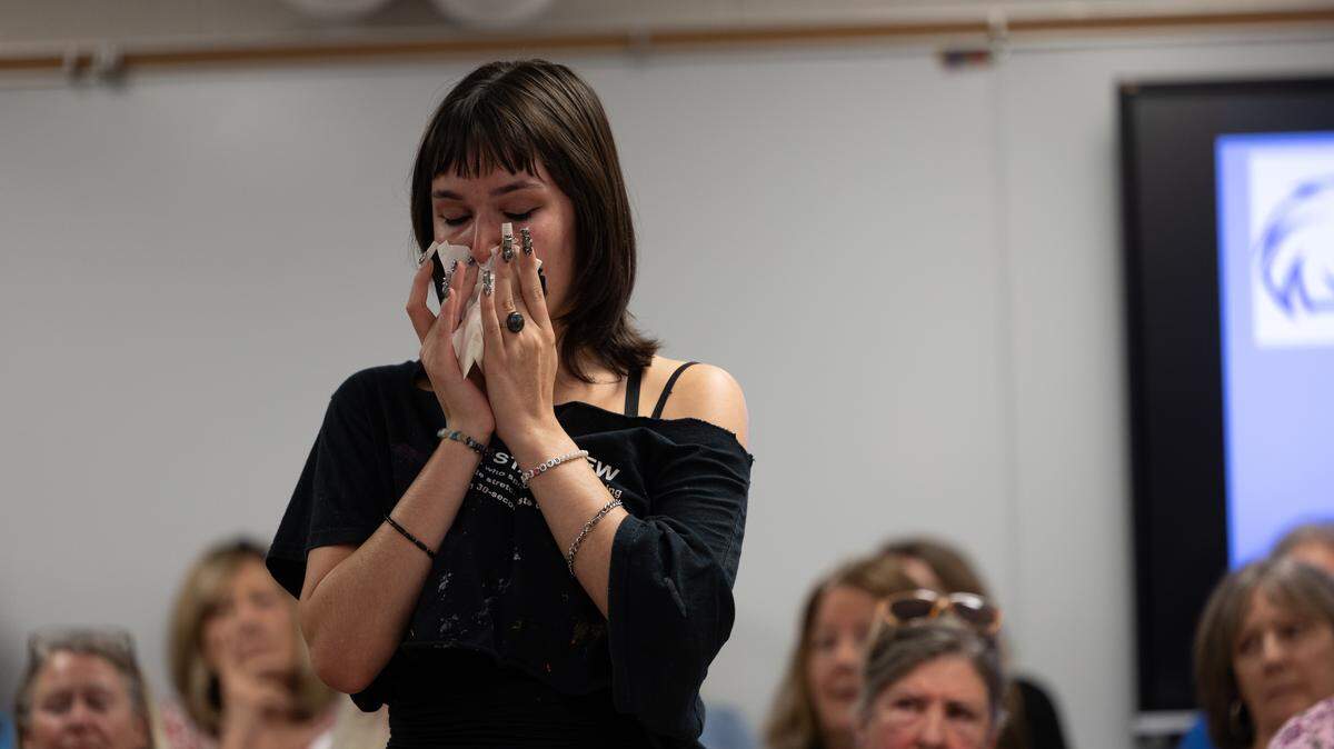 Kaelyn O’Brien, a Columbia High School graduate, is overcome with emotion when describing high school English teacher Mary Adams, who resigned after her alleged social media post about recently-slain Charlie Kirk went public and she became the target of what speakers described as a bullying campaign.