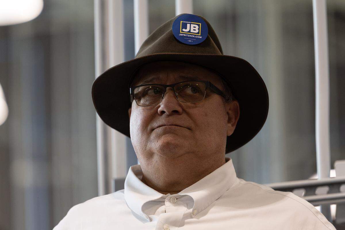 Iron workers local 392 business manager John Schmitt watches Illinois Gov. J.B. Pritzker announce his intentions to run for a third term in 2026. “I love J.B.,” Schmitt said.