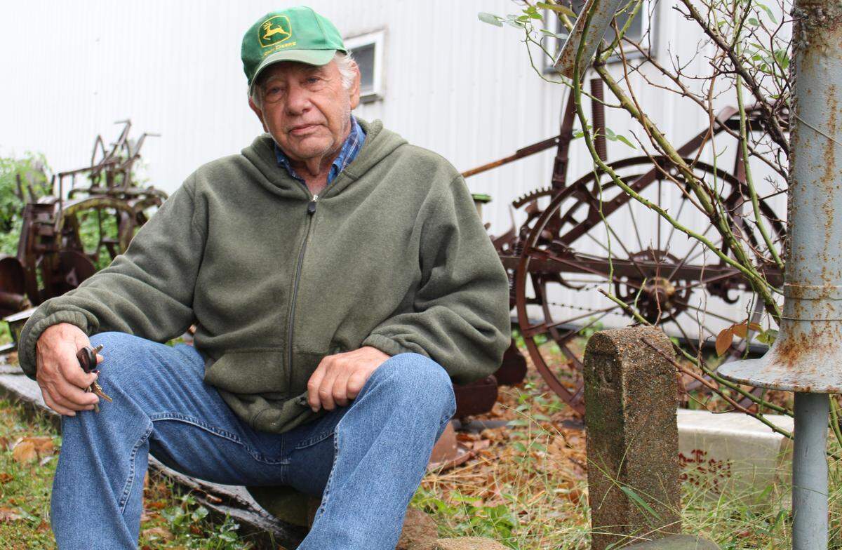 Farmer Carl Weissert has an artifact collection that includes concrete grave markers from a former pauper’s cemetery in Washington Park that was moved in the 1960s.