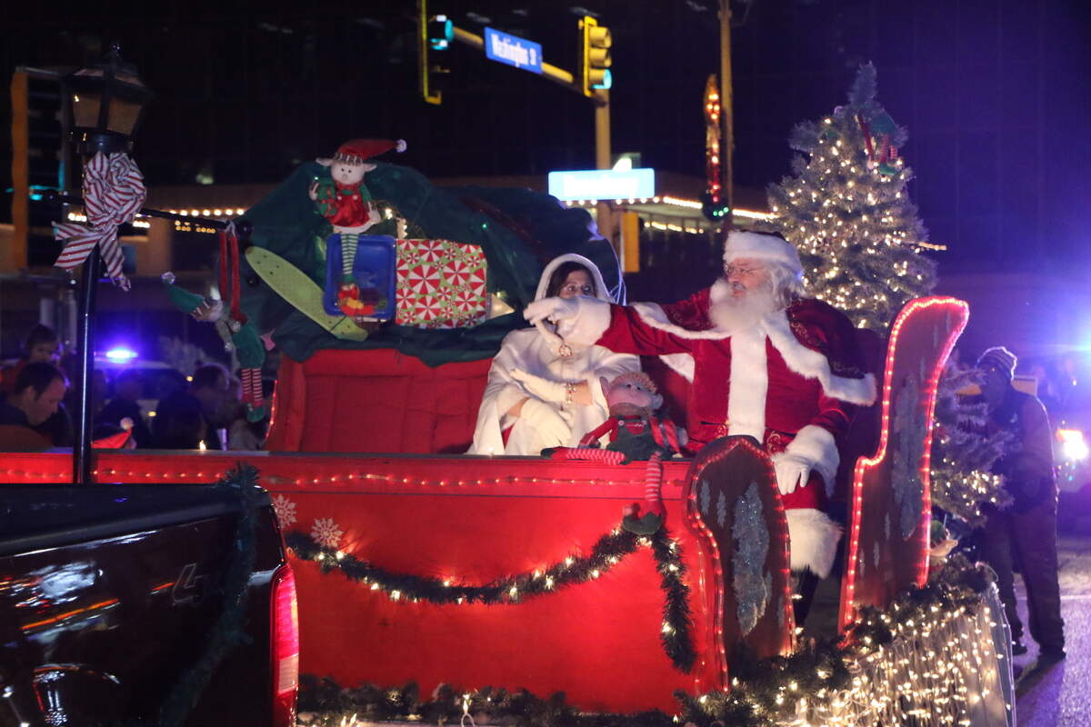 Santa waves to the crowd during Highland’s annual Lighted Christmas Parade Saturday, Nov. 24. The parade was delayed one day due to rainy weather the night before.