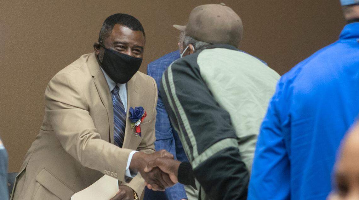 Curtis McCall Sr, the first mayor of Cahokia Heights, is congratulated after being sworn in.