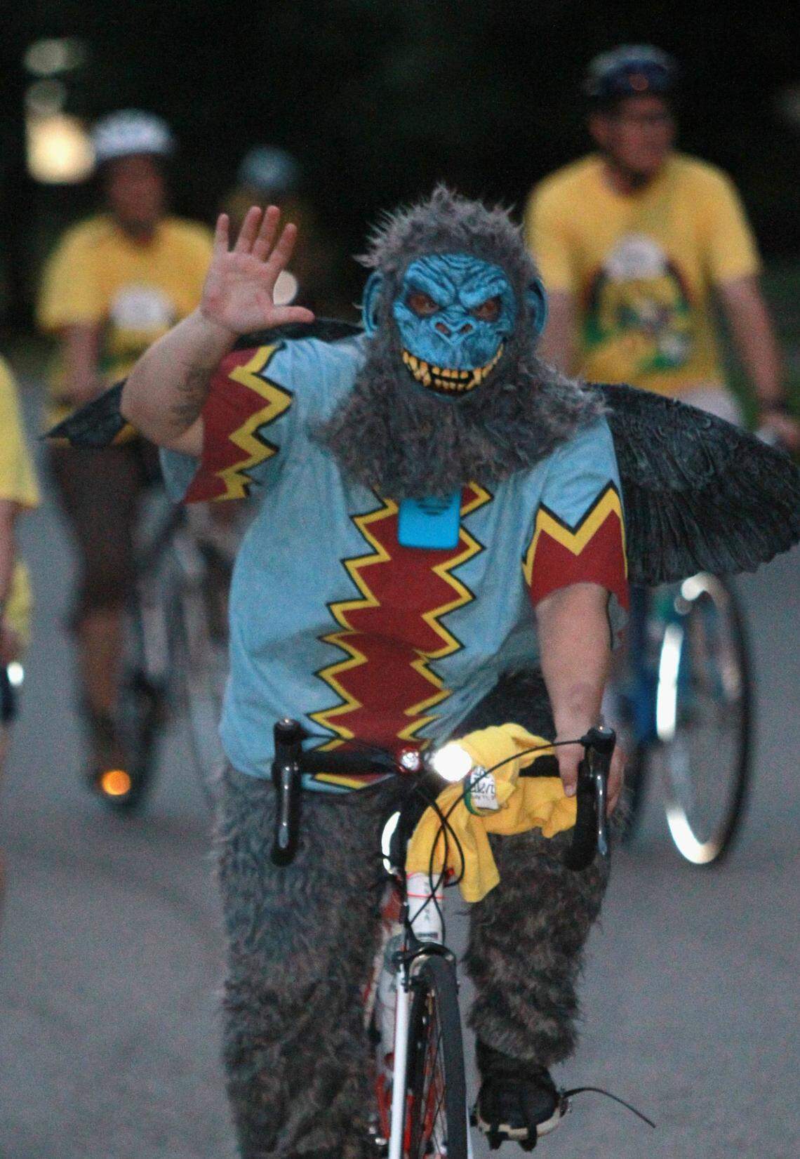 Kendra Campbell, of Breese, wears a flying monkey costume for the ride.