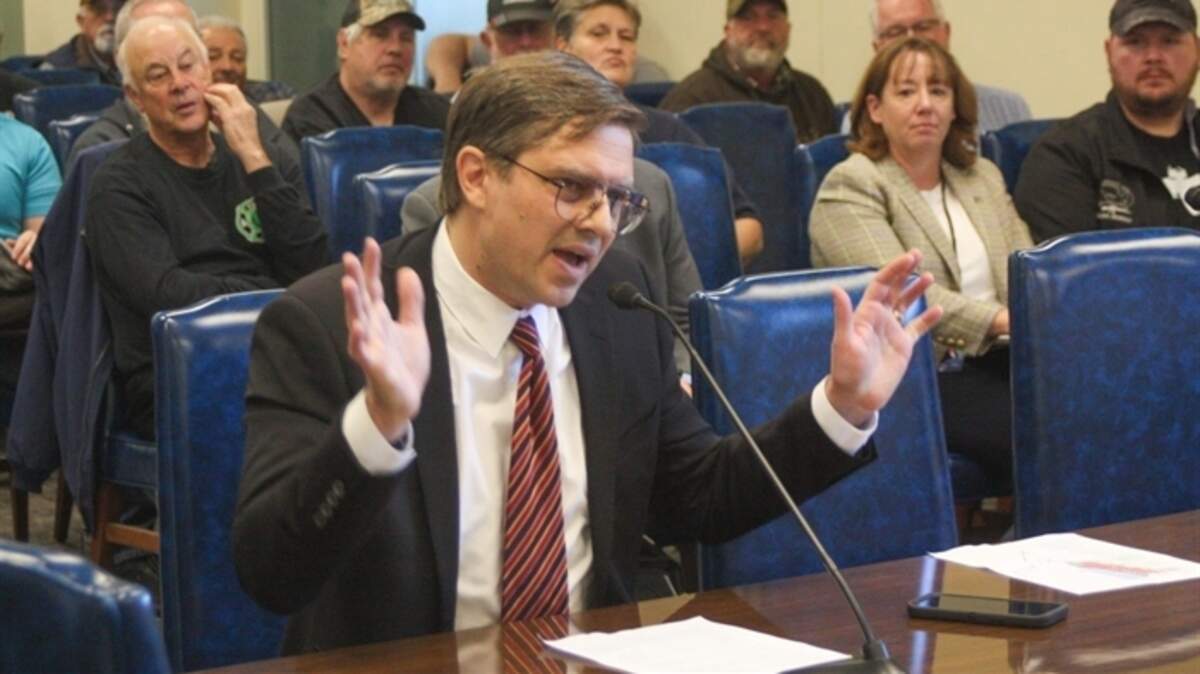 Gregory Magnuson, an Illinois resident, testifies at a public hearing Thursday in Springfield in opposition to proposed rules that would require owners of certain kinds of firearms to register them with the Illinois State Police to be able to legally keep them.