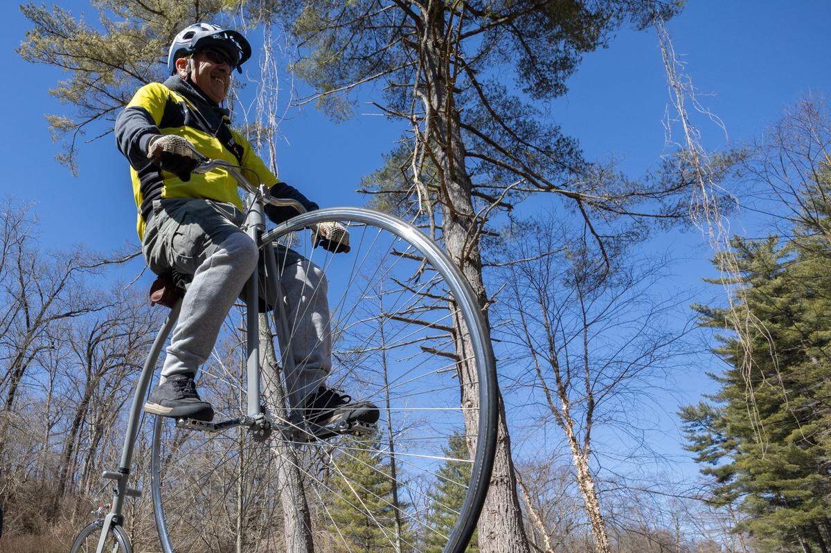 Michael Goodwin rides his custom penny-farthing bicycle at the opening of the Tecklenburg Trail earlier this year. The trail is operated by St. Clair County Transit District. 