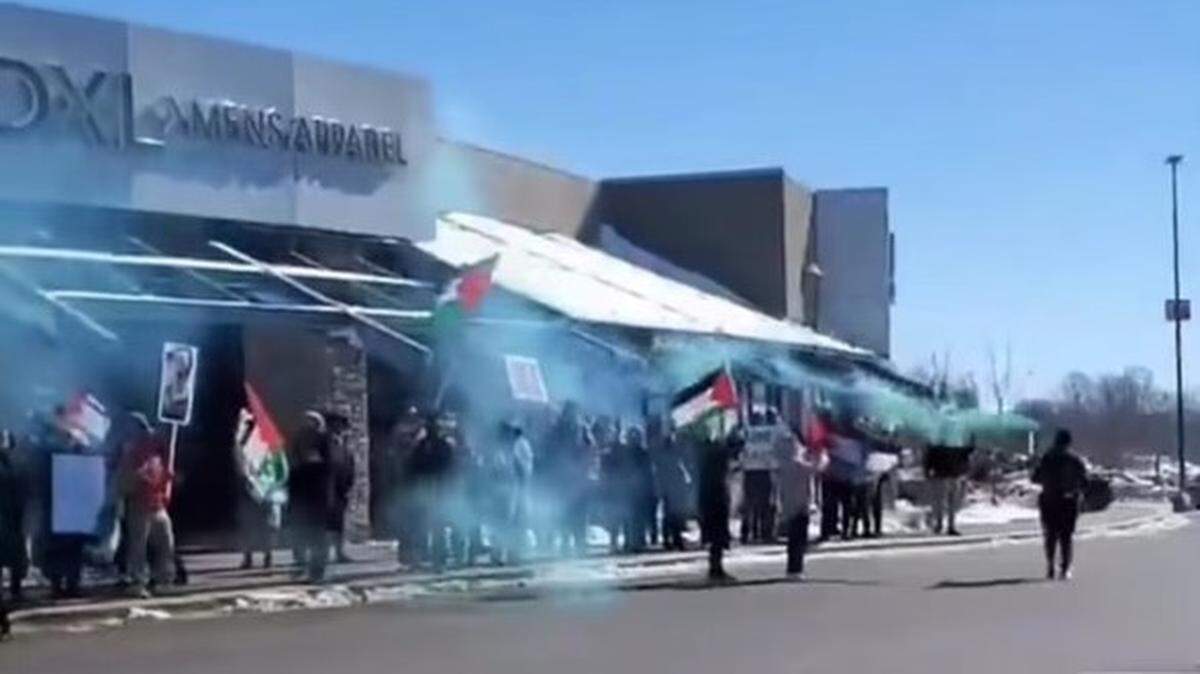 An estimated 75 people participated in a pro-Palestinian protest outside St. Clair Square on Saturday afternoon, prompting mall officials to lock the doors for more than an hour.