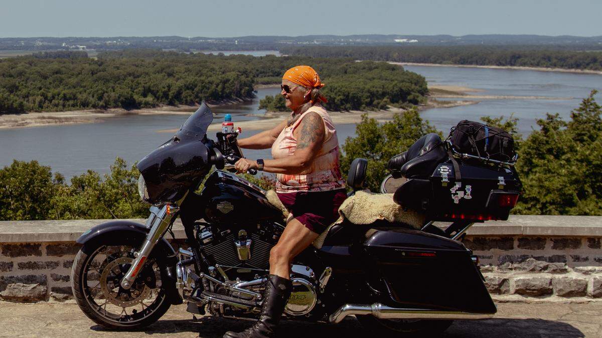Tina Weber rides up to the Kaskaskia River overlook on Saturday, Aug. 10, 2024, near Modoc, Illinois.