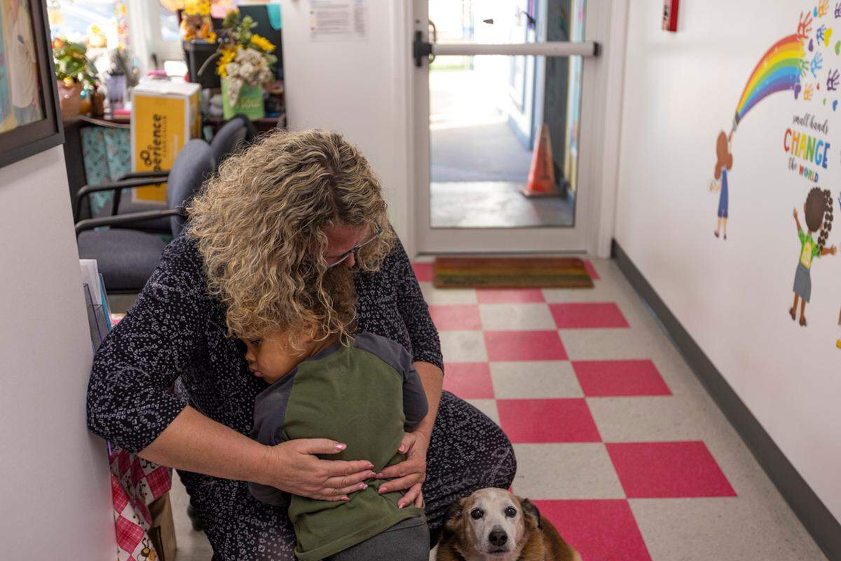 Heather comforts Raydyan Taylor, 2.