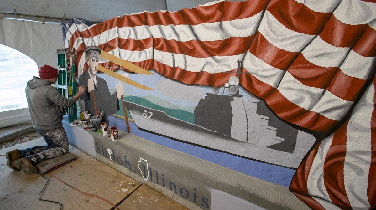 Mural Artist, Ray “Bubba” Sorensen II, paints a Freedom Rock in Shiloh. Sorensen is known for his original Freedom Rock he painted in 1999 in Iowa, now there is one in every county in Iowa. He is continuing to honor veterans with The 50 State Freedom Rock Tour by thanking Veterans and providing a unique Freedom Rock for all 50 states in America.