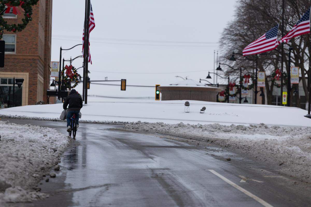 A lone biker makes his way down Illinois Street in Belleville on Jan. 6, 2025.