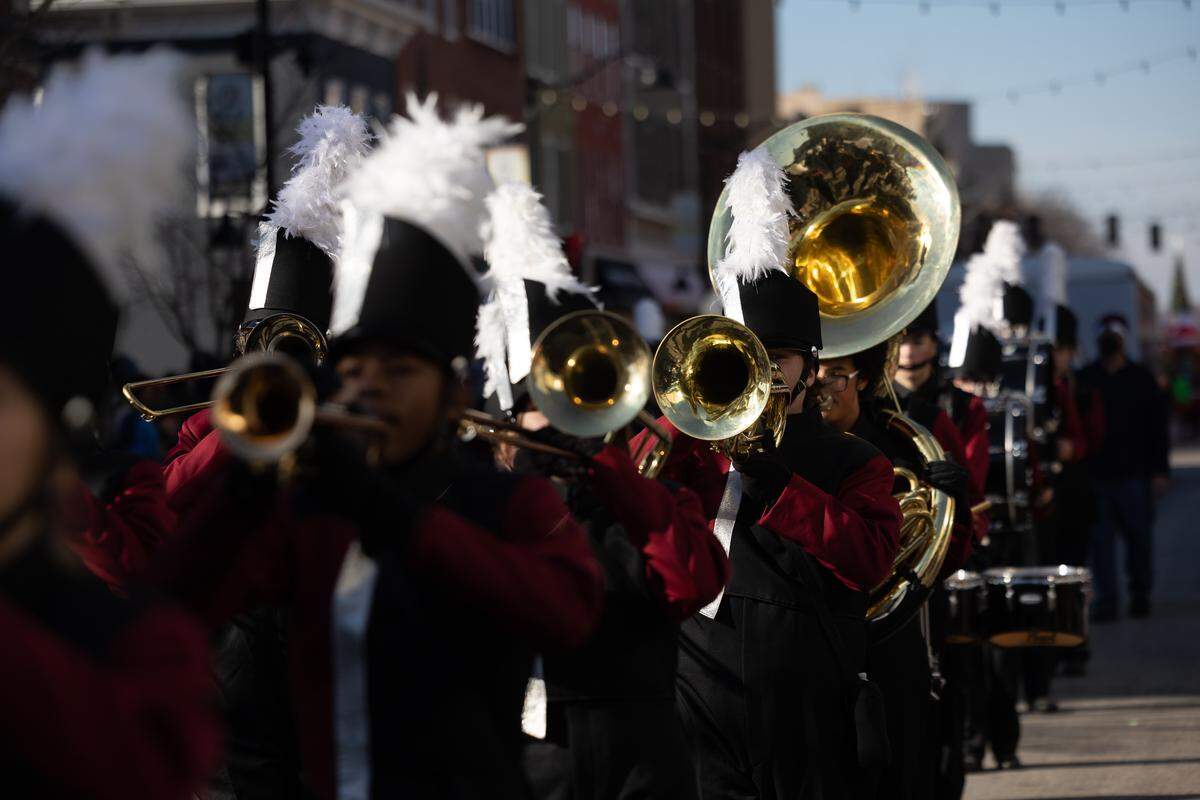Belleville West Maroons march down Belleville’s Main Street during the 2025 annual Santa Parade.