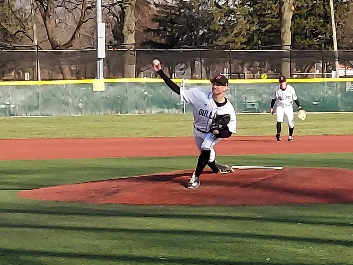 Highland’s Trent Clements delivers a pitch during a non-conference game against O’Fallon on Tuesday, March 29, at Blazier Field in O’Fallon. The Bulldogs dropped a 4-3 decision in eight innings.
