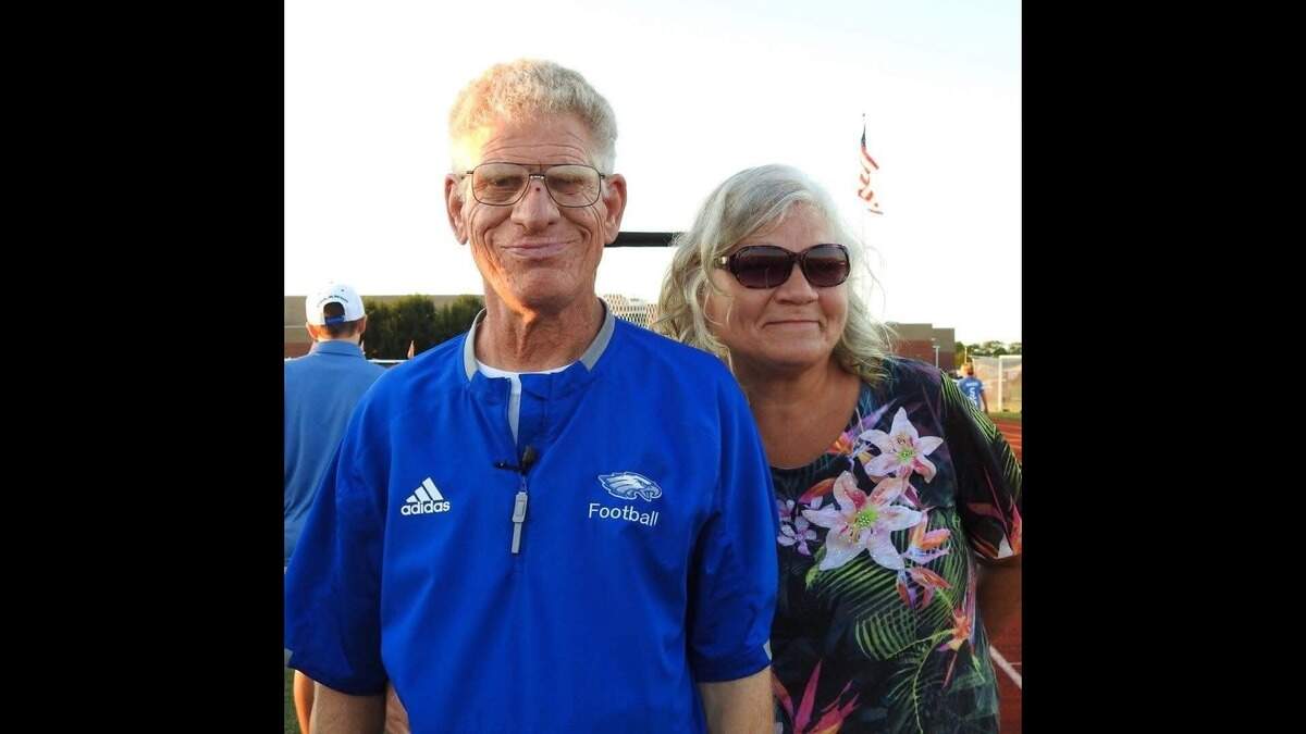 Coach Mike Kuhlmann proudly sports Columbia blue with his sister Angie Medina.