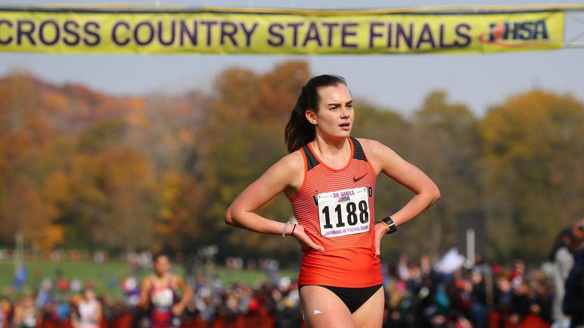 Waterloo’s Jenna Schwartz  after finishing her run at the IHSA Class 2A State Cross Country Championships at Detweiller Park in Peoria Saturday.