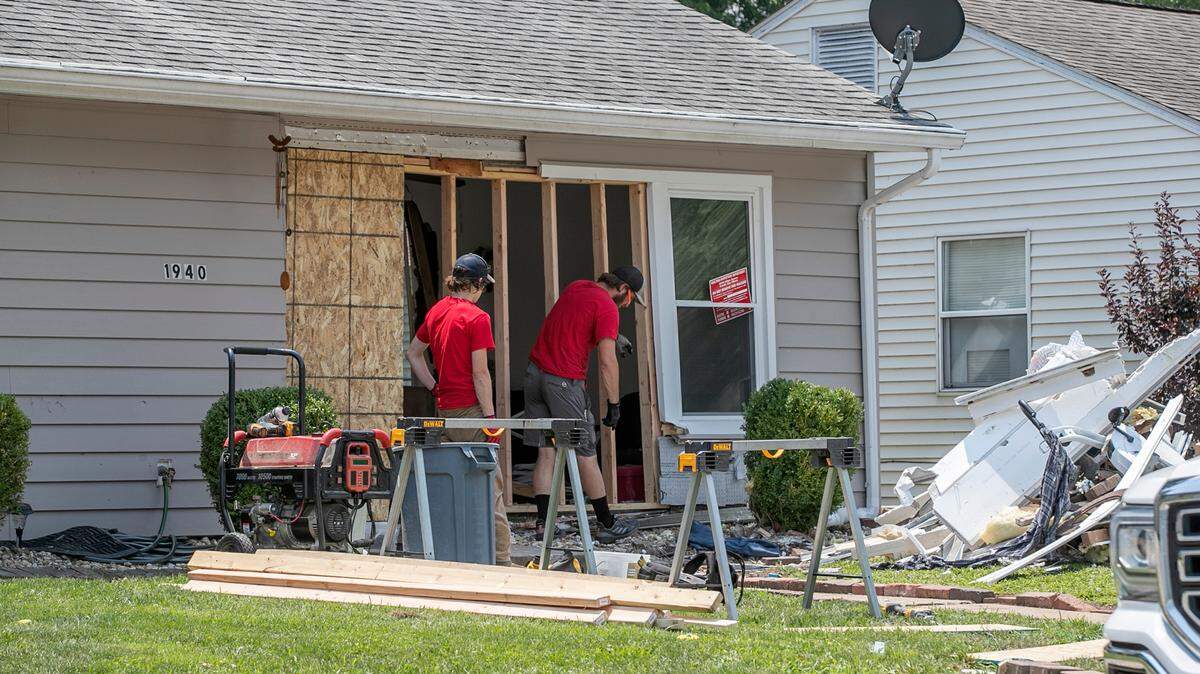 A 73-year-old Granite City woman died after a vehicle smashed into a home located in the 1900 block of Joy Avenue in Granite City, one person has been arrested.