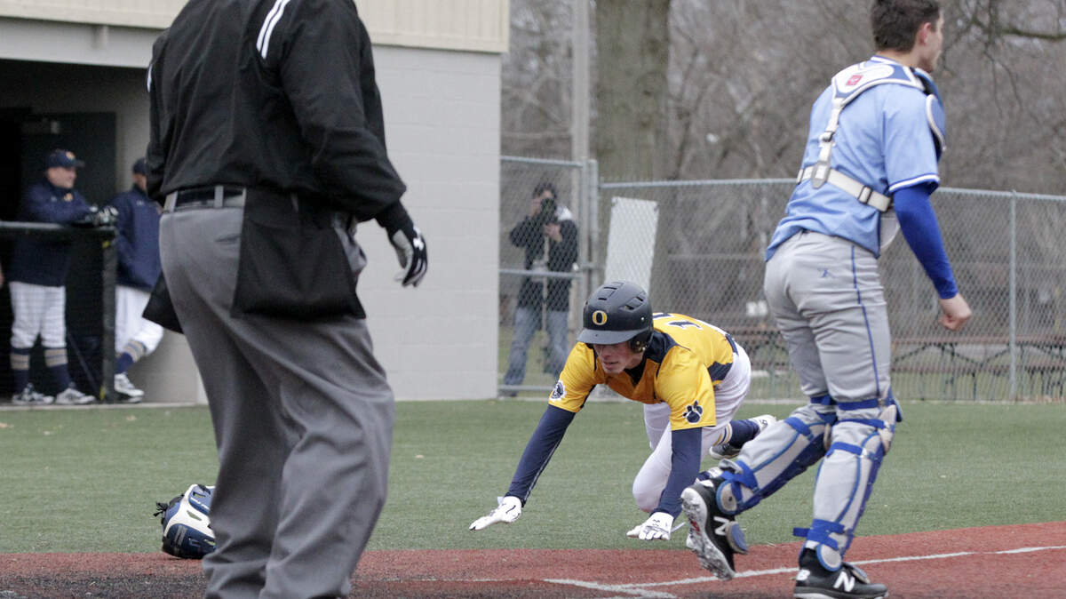 O'Fallon's Jake Holan slides in safe at home against the Columbia Eagles on Tuesday, March 20. The Panthers won the game 12-4.