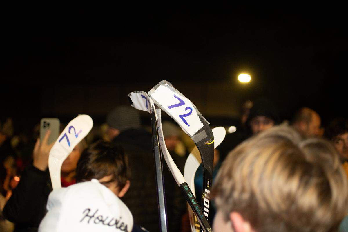 Supporters hold hockey sticks with the number 72 written on the ends in support of Colin Brown, 16, who was hit by a stray bullet in his car while going home to O’Fallon from a hockey game with his father on Interstate 55 in St. Louis. Friends gathered for the vigil at the McKendree MetroRecplex in O’Fallon Monday.