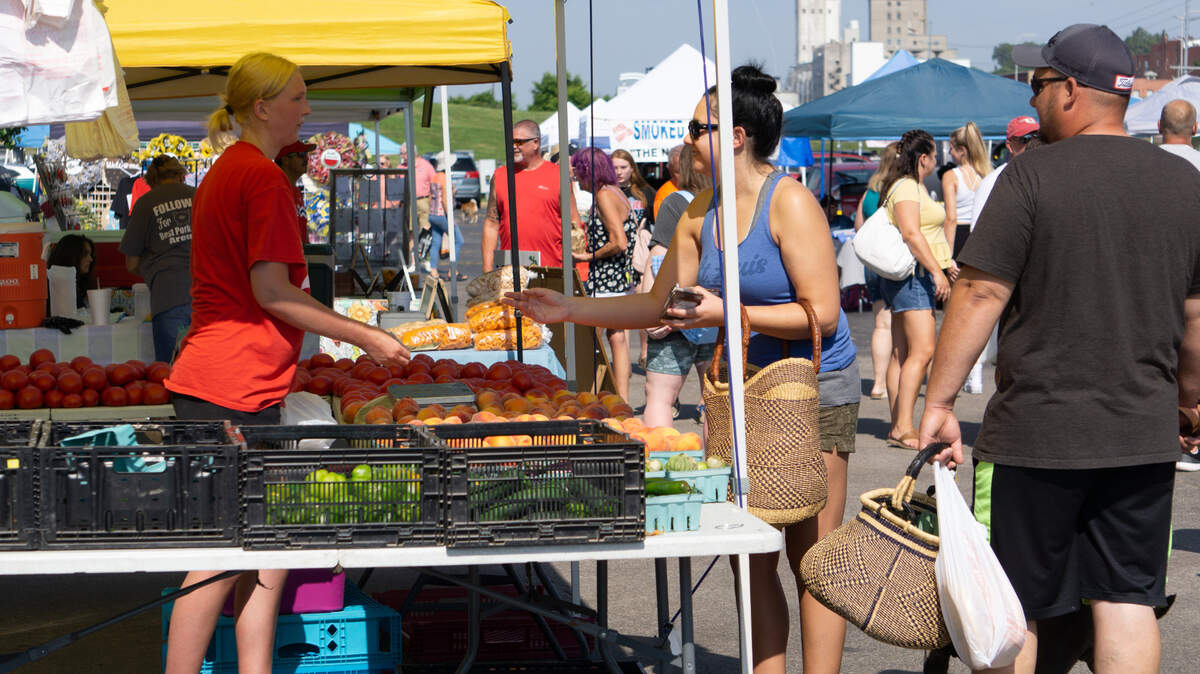 Farmers markets are about to kick off for the 2026 season. Pictured: Vendors and customers at the Alton Farmers’ & Artisans’ Market in 2022