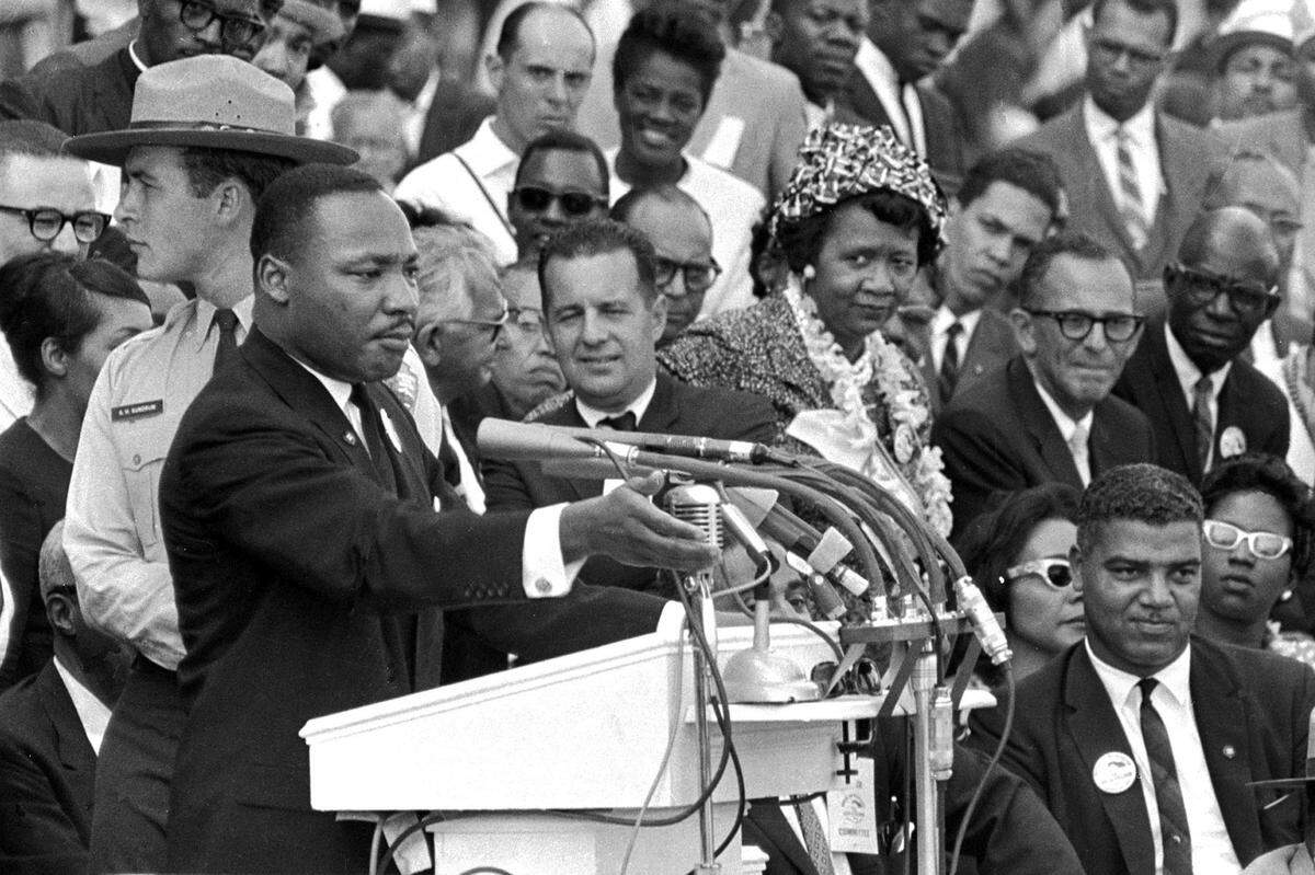 FILE - The Rev. Dr. Martin Luther King Jr., delivers his “I Have a Dream” speech in Washington, Aug. 28, 1963, as National Park Service ranger Gordon “Gunny” Gundrum, left, stands beside King. (AP Photo/File)