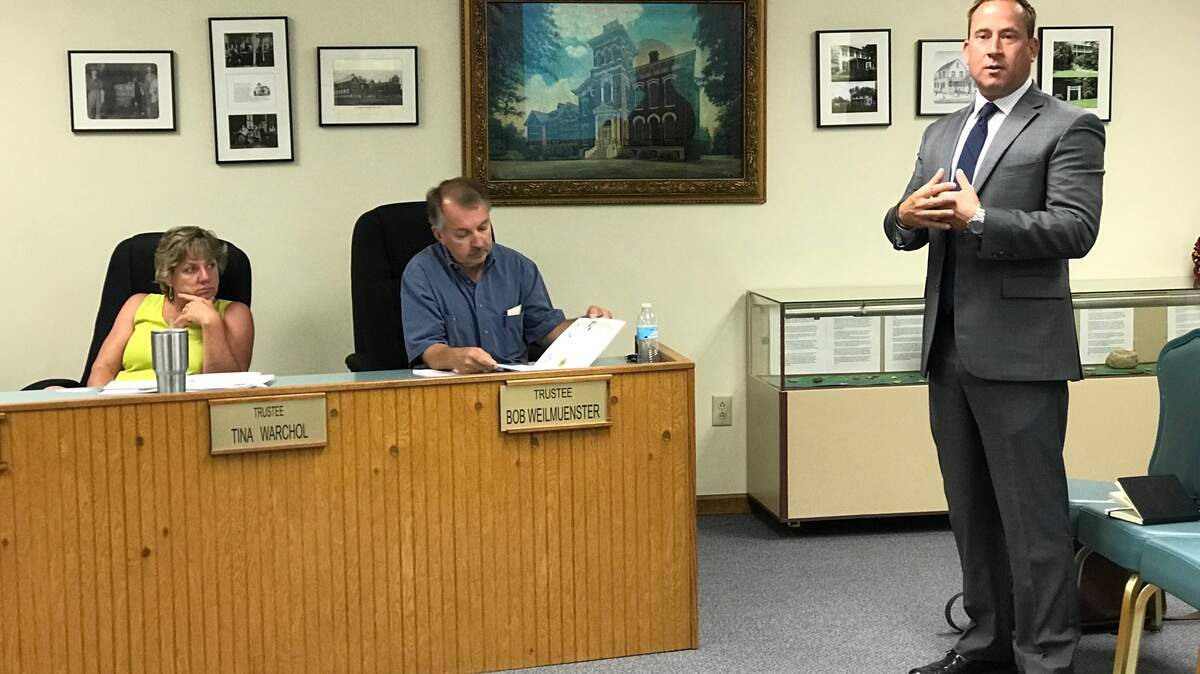 From left, Shiloh trustees Tina Warchol and Bob Weilmuenster listen to Dennis Maher, vice president of Buxton analytics and marketing company, who on Tuesday, May 29 pitched his company's services to help with economic development in the village.